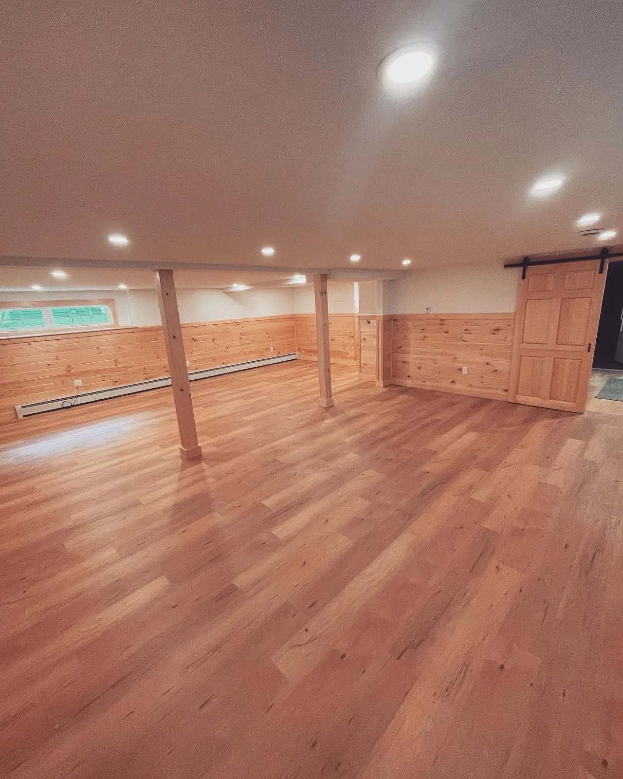Finished basement with tongue and groove knotty pine walls in Lyman, Maine