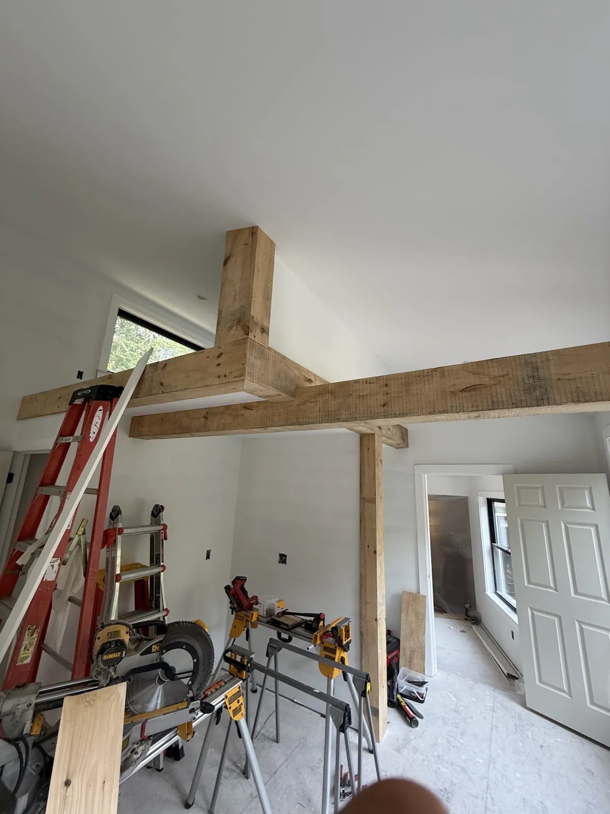 Two-story addition with rustic timber beam framing in Kennebunk, Maine